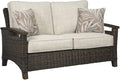 Signature Design by Ashley Paradise Trail Outdoor Loveseat with All Weather Cushions, Nuvella Weather Resistant Fabric, Medium Brown