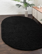 Unique Loom Solid Shag Collection Area Rug (5' 1" x 8' Oval, Jet Black)