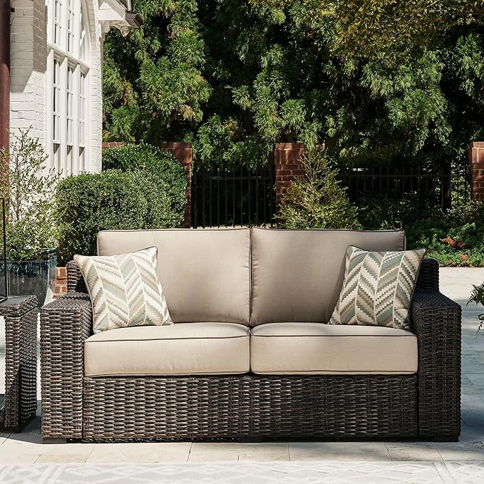 Signature Design by Ashley Coastline Bay Casual Weather Resistant Outdoor Loveseat with Cushion and 2 Throw Pillows, Nuvella Weather Resistant Fabric, Beige & Dark Brown